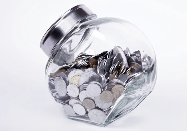 Overflowed bank with coins — Stock Photo, Image
