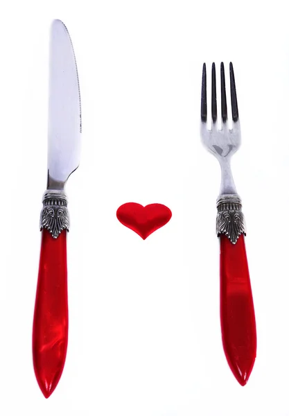 Piros dugó és kés közelében szív szimbólum — Stock Fotó