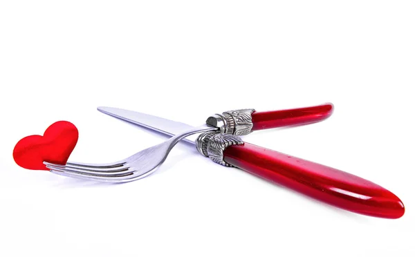 stock image Red plug and knife near heart symbol