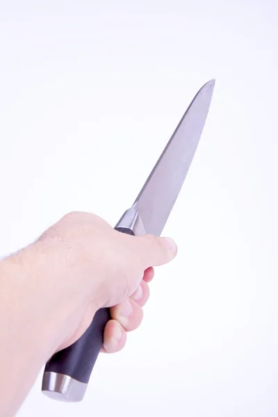 Hand met een mes geïsoleerd op wit — Stockfoto
