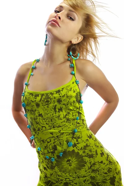 Attractive blonde in a green dress. — Stock Photo, Image