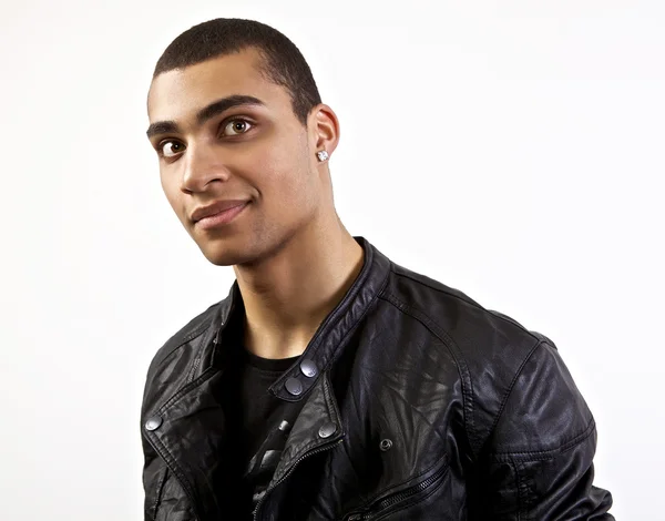 Young stylish mulatto in a leather jacket. — Stock Photo, Image