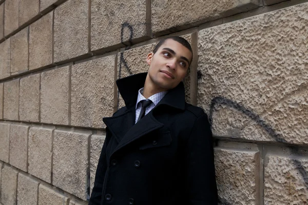 Young beautiful mulatto near old wold. Man and urban. Evening outdoor shoot — Stock Photo, Image