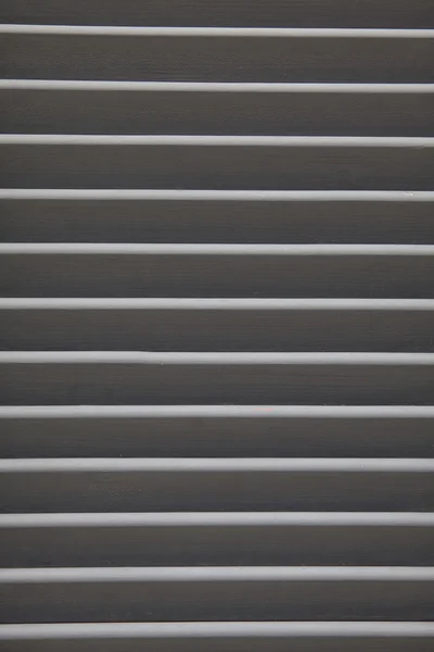 Grey shutters over a shop doors — Stock Photo, Image