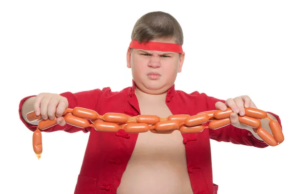 Gordo menino mau com salsicha — Fotografia de Stock