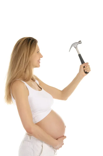 Felice donna incinta con un martello , — Foto Stock
