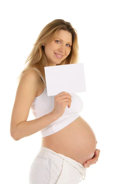 Mulher grávida feliz com um formulário em branco — Fotografia de Stock