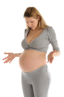 Astonished pregnant woman in gray suit clipart