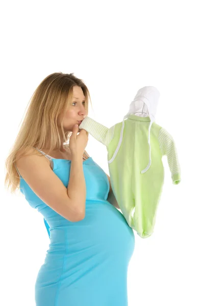 Femme enceinte acheter des vêtements de bébé — Photo