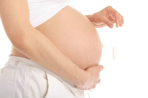 Těhotná žena držící zkumavku s spermií — Stock fotografie