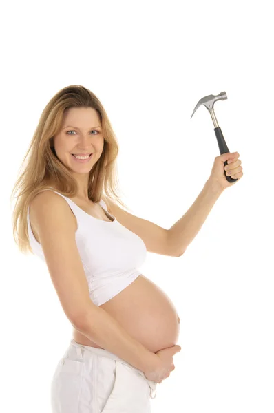Gelukkig zwangere vrouw met een hamer, — Stockfoto