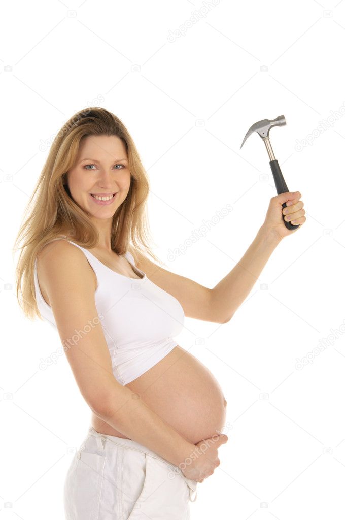 Happy pregnant woman with a hammer,