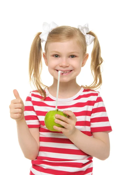 Girl drinking apple juice through straw — Stock Photo, Image