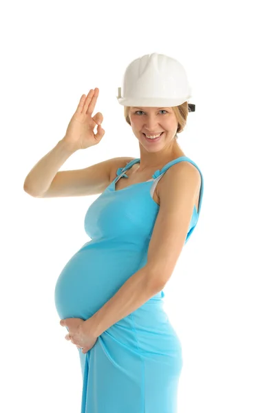 Mulher grávida feliz no capacete — Fotografia de Stock