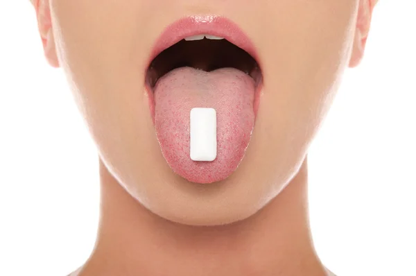 Chewing gum in the tongue of woman — Stock Photo, Image