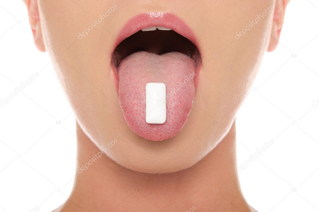 Chewing gum in the tongue of woman