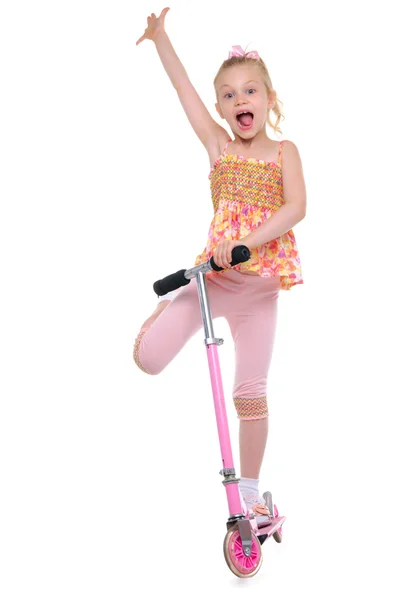Menina feliz em scooter — Fotografia de Stock
