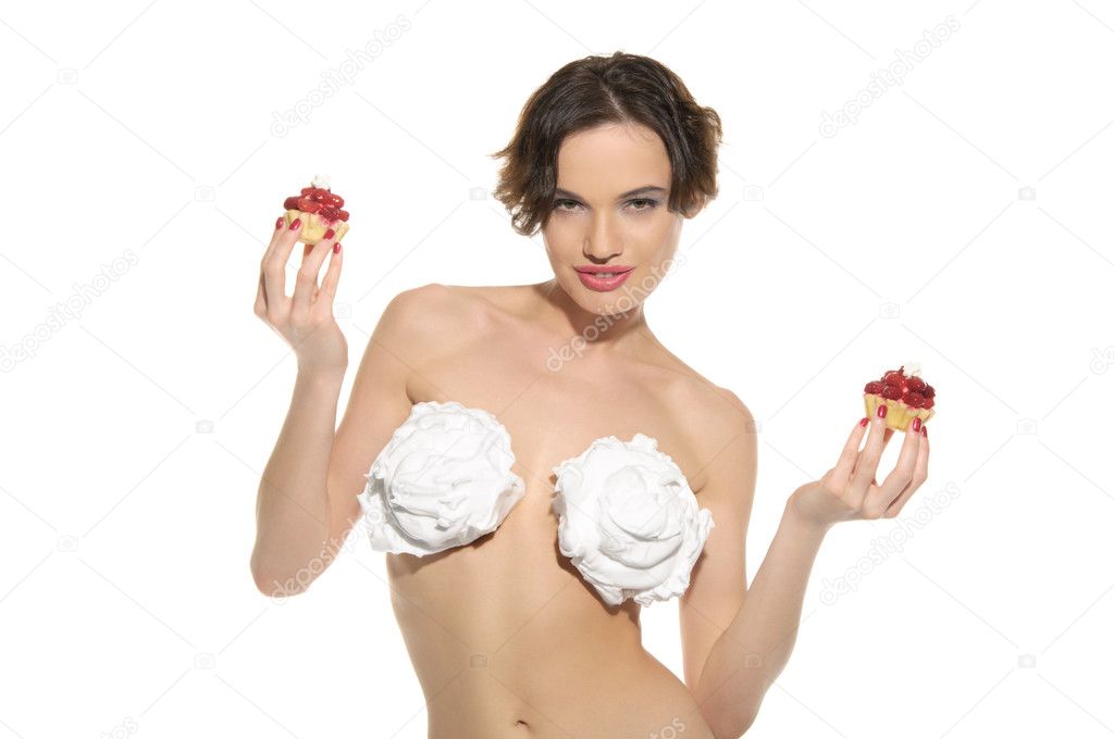 Sexy woman with cream on his chest and pastry