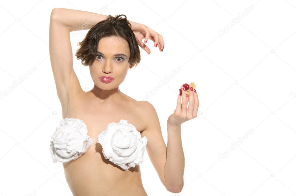 Beautiful sexy woman with cream and pastry