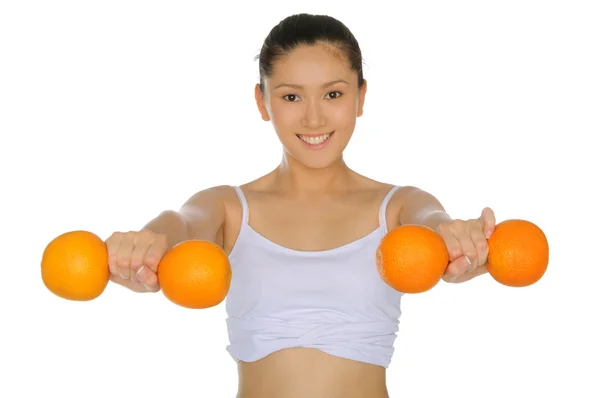 Asian woman engaged in fitness of oranges — Stock Photo, Image