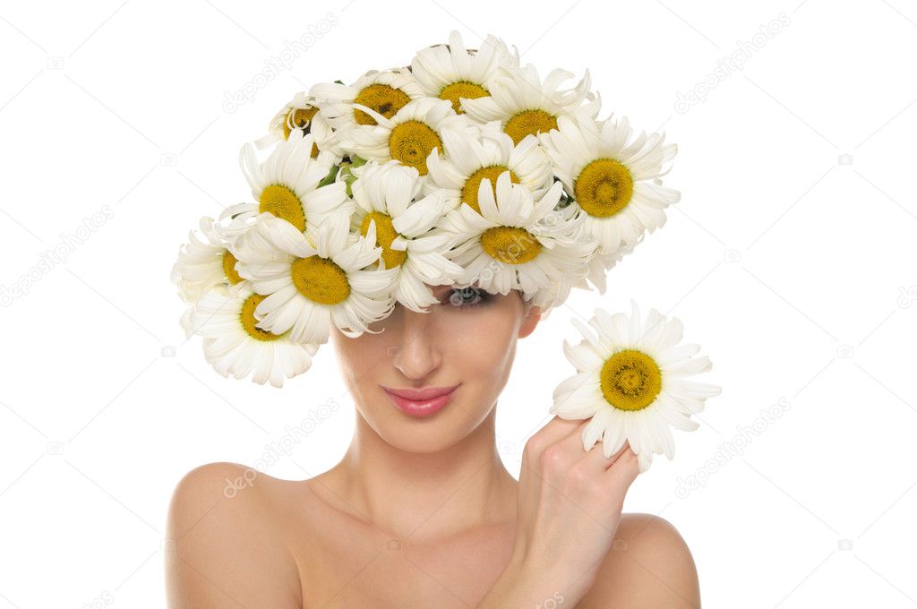 Beautiful woman in the hat of daisies