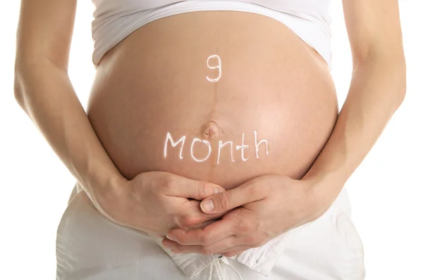 Stomachs z napisem "9 miesiąc " — Zdjęcie stockowe