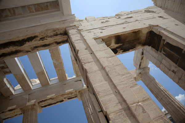 Columns of entrance propylaea to ancient temple Parthenon in Acropolis Athens Greece on blue sky background