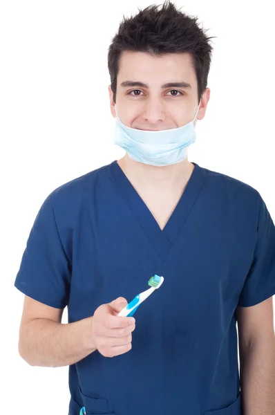 Стоматолог с зубной щеткой — стоковое фото