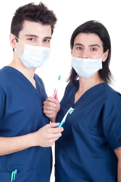 Doktorlar ekibi ile diş fırçası — Stok fotoğraf