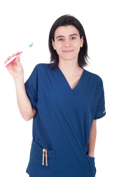 Dentista segurando escova de dentes — Fotografia de Stock