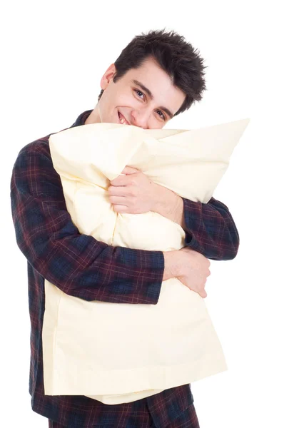 Muž v pyžamu drží polštář — Stock fotografie
