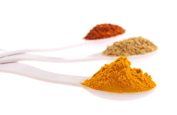 Indian spices in spoons — Stock Photo, Image
