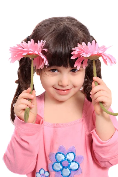 Cute little four year old girl with daisies — Stock Photo, Image