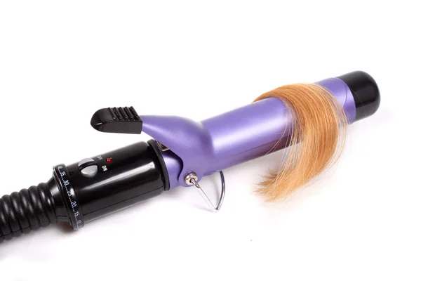 Светлые волосы и электрощипцы для кёрлинга — стоковое фото