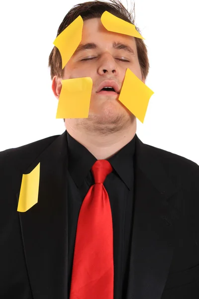 Tired businessman with sticky note paper — Stock Photo, Image