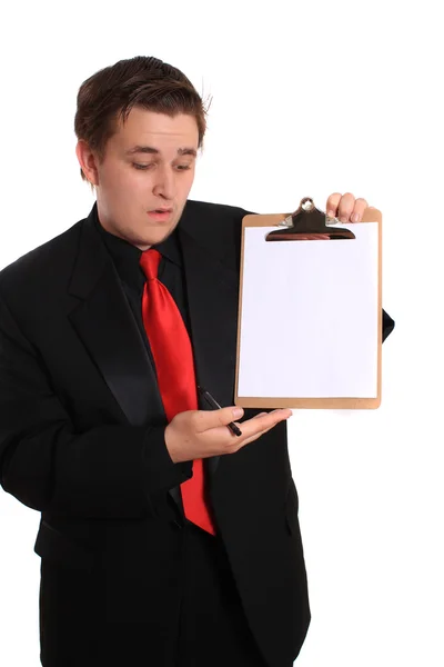 Hombre sujetando portapapeles con página en blanco —  Fotos de Stock