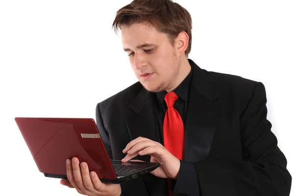 Człowiek z mały komputer laptop — Zdjęcie stockowe