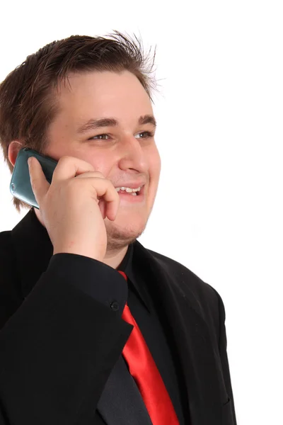 Jungunternehmer im schwarzen Anzug telefoniert — Stockfoto