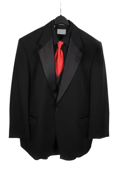 Hanging three piece suit with red tie — Stock Photo, Image