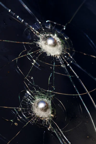 Bullet glass broken sphere — Stock Photo, Image
