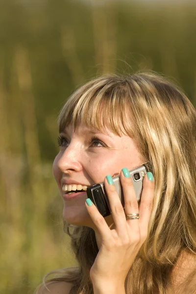 stock image Woman talking phone nature