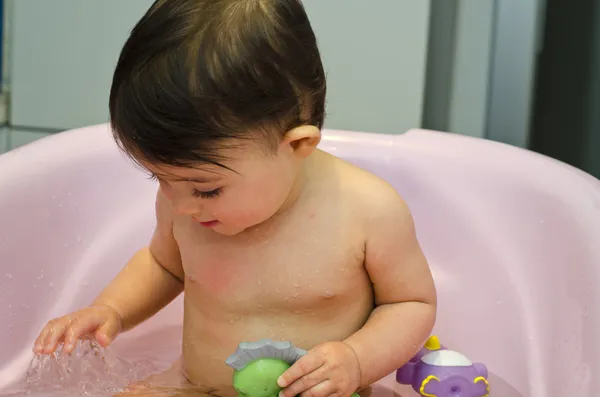 1 year old Baby Girl Making Bath — стоковое фото