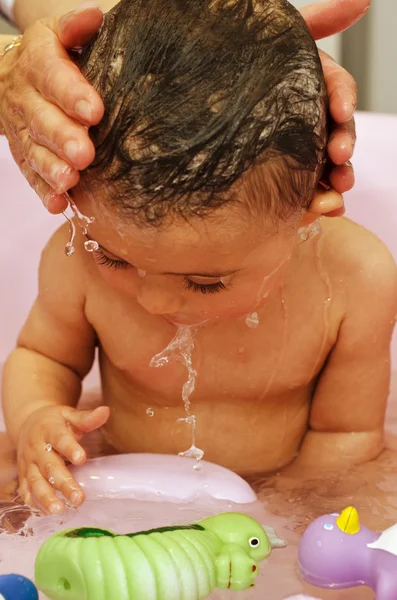 1 year old Baby Girl Making Bath — стоковое фото