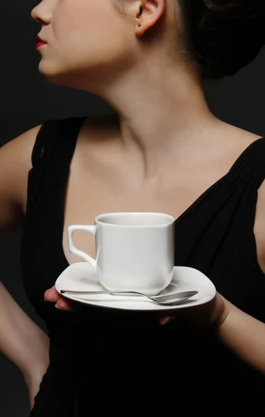 stock image Woman holding a cup of black coffee