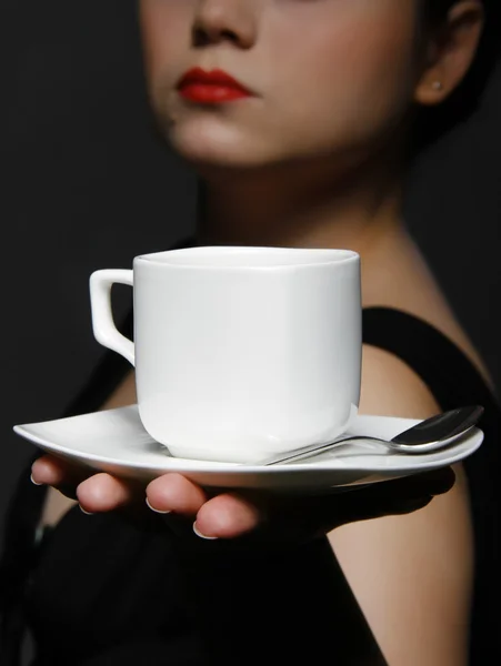 stock image Woman holding a cup of coffee