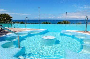 Swimming pool with jacuzzi at luxury hotel, Tenerife island, Spa clipart