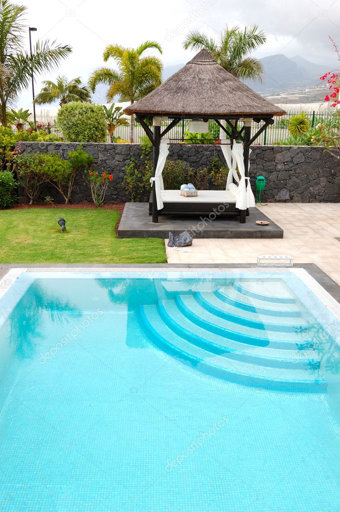 Bali type hut and swimming pool at luxury villa, Tenerife island