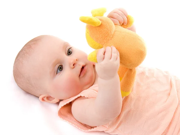 Das Kind mit einem Spielzeug in der Hand. — Stockfoto