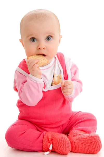 Criança come em um fundo branco . — Fotografia de Stock