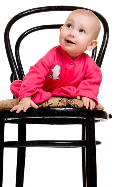 Dzieciak siedział na krześle. — Zdjęcie stockowe